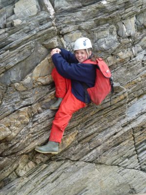 Primary school residential rock climbing on sea cliffs Wales